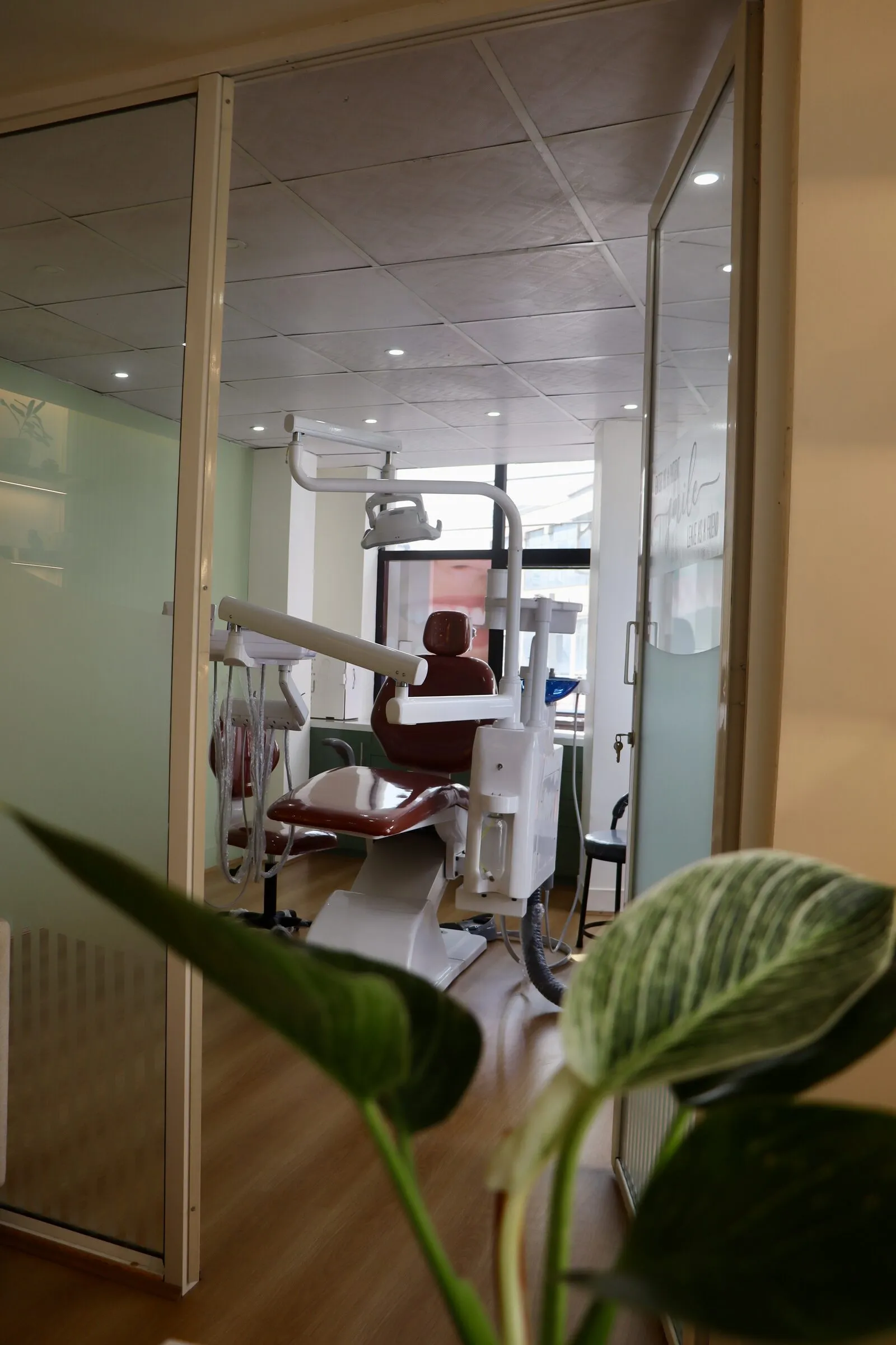 View through frosted glass into a bright treatment room