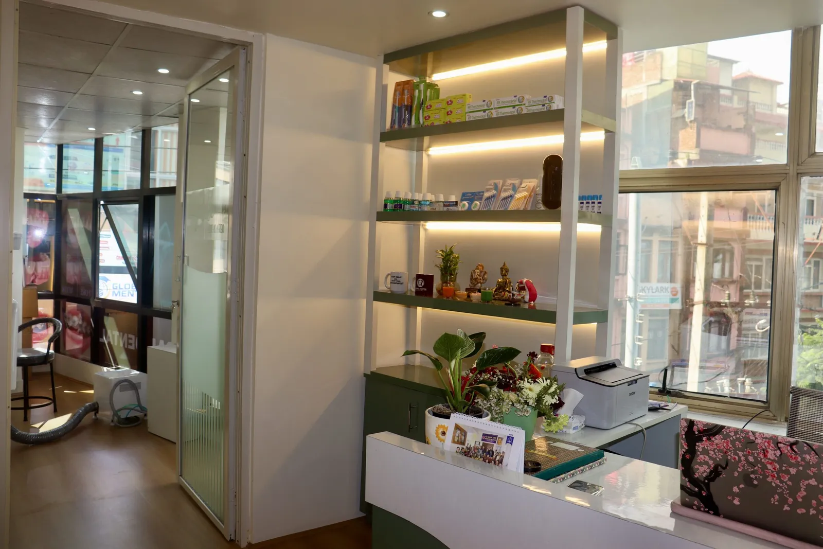 Warmly lit shelves beside the reception